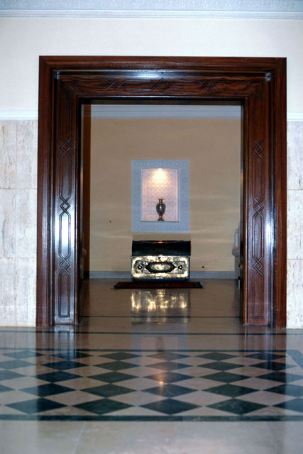 Interior view, showing wood framed entrance and marble floors