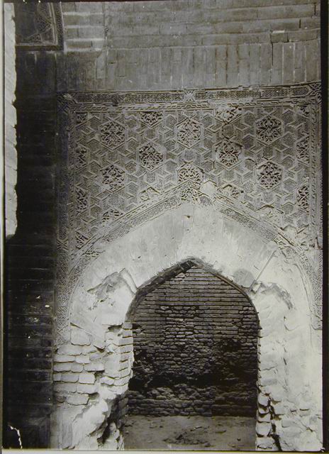 Doorway, with carved terracotta spandrels, to chamber directly south of north-south hall crossing entry axis on west side