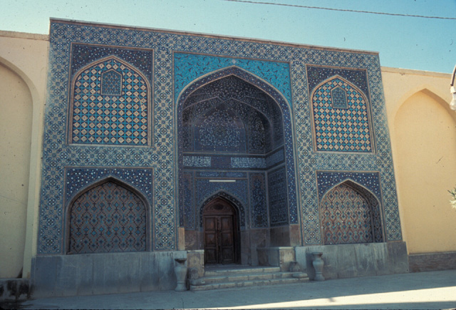 Southwest facade of northeast courtyard, view of central portal leading to madrasa before recent restorations.