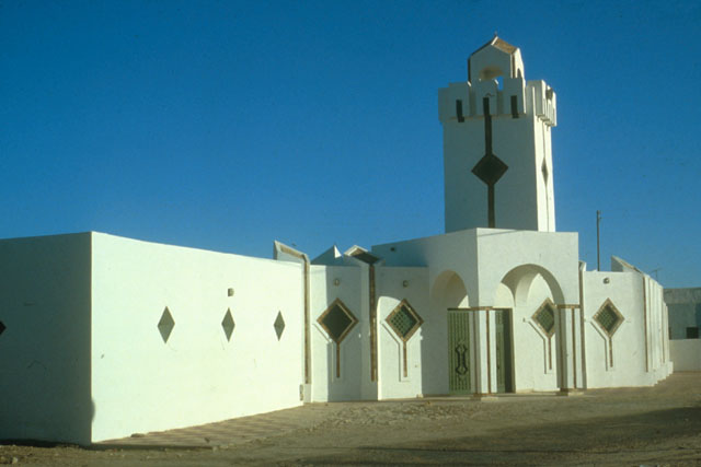 Exterior view highlighting impact of angled walls and minaret