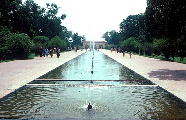 Exterior view of the first terrace: pool with fountains and adjacent paved paths