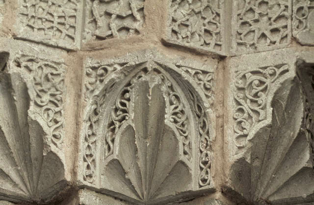 Detail of main portal showing carved arabesques on muqarnas semi-vault