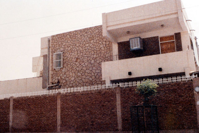 Exterior view showing brick and stone façade