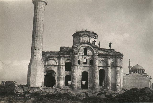 Exterior view from south, showing damage after 1911 fire.    The Laleli Mosque is seen in the background