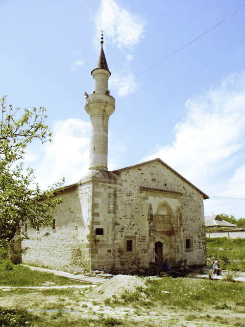 Exterior view from northeast showing the main portal and the minaret