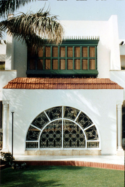 Exterior view showing different window treatments