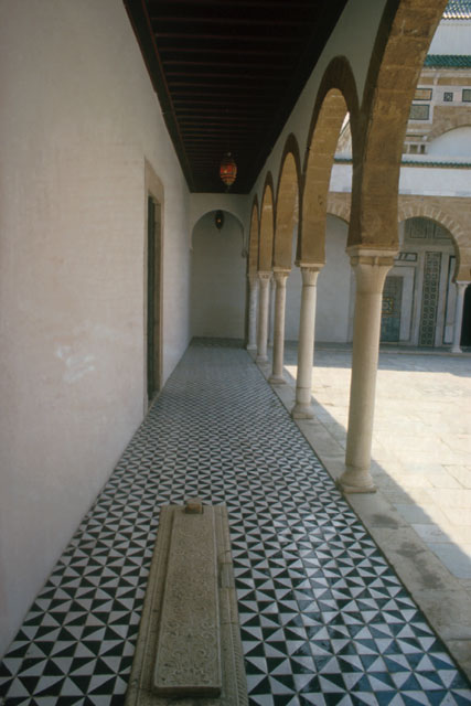Exterior detail showing tile work along arcade floor