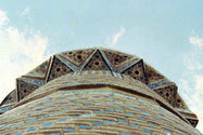 Detail of minaret; tiled muqarnas supports of balcony