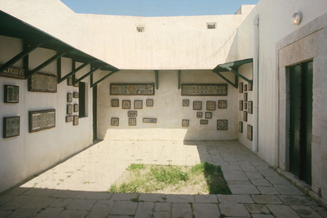 Exterior view showing transitional courtyard used as a gallery
