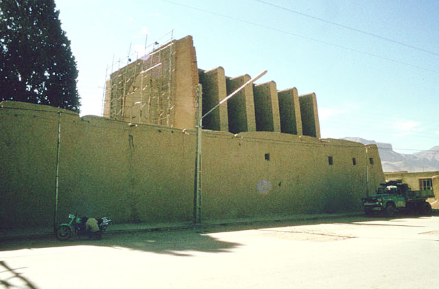 Exterior view from north showing northwest wall and buttressed walls of sanctuary iwan