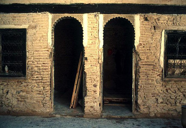 Entrances to ground-floor rooms on courtyard
