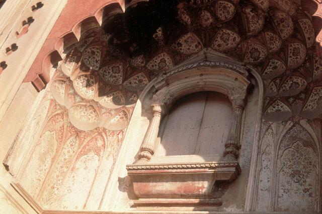 Detail from portal, showing decorative balcony inside niche with cusped arch