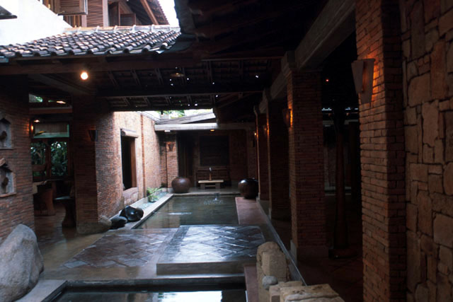Water ponds occupy the space between the inner pendopo (right ) and the entrance to the main house (left)