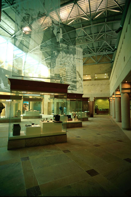 Interior view showing display cases in two story gallery