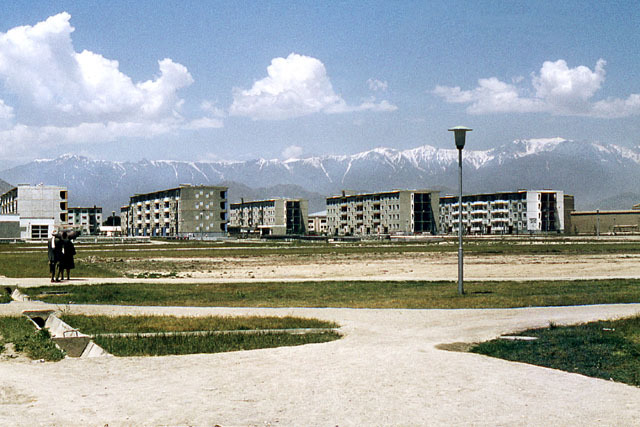 General view of the housing project, under construction, with parklands in foreground