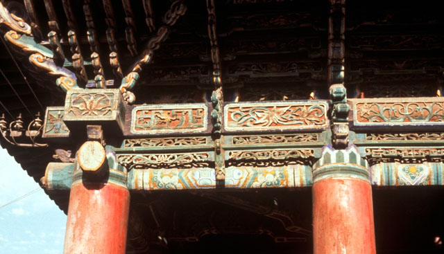 Detail of dougong brackets and painted beams of prayer hall exterior