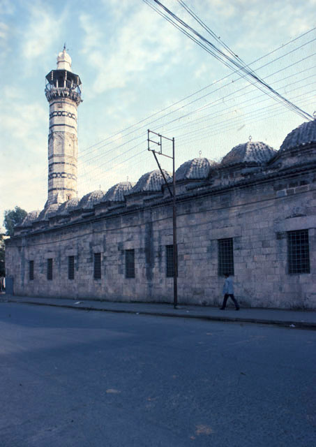 Exterior view from northwest showing windows along the courtyard wall and the minaret