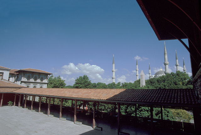View looking east from the great hall (divanhane) towards the wooden gazebo facing Atmeydani, showing the obelisk on Atmeydani and the Blue Mosque behind; the land registry building from 1908 is seen in the left background
