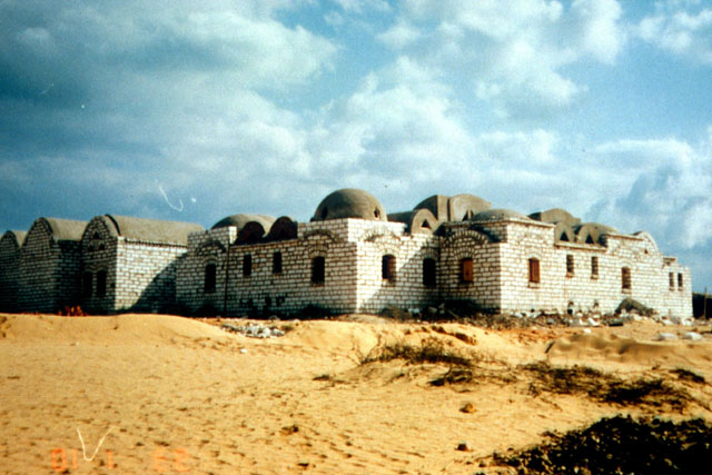 Exterior view showing poured concrete domes