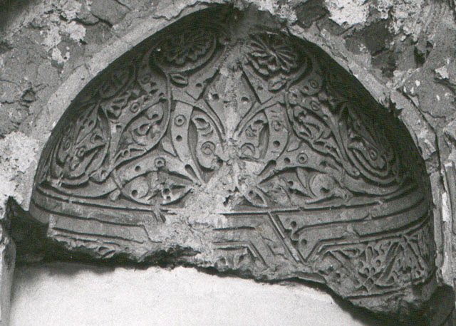 Detail of stucco mihrab, showing carved hood of niche