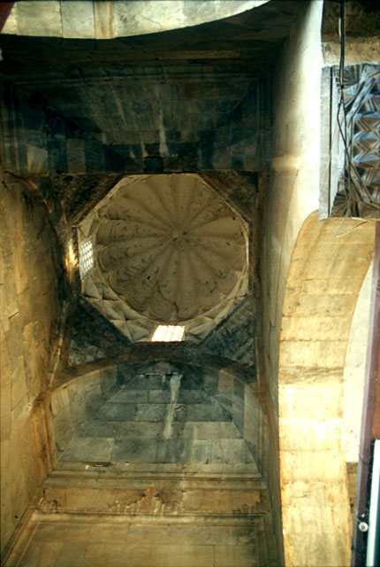 Looking up at the umbrella vault covering the central bay of portico