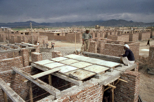 Placement of precast roof panels between beams