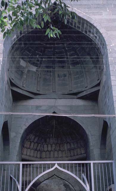 Detail of portal, showing semi-vaults crowning two of the nestled niches
