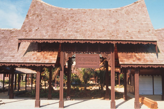 Exterior detail showing commemorative plaque and shelters