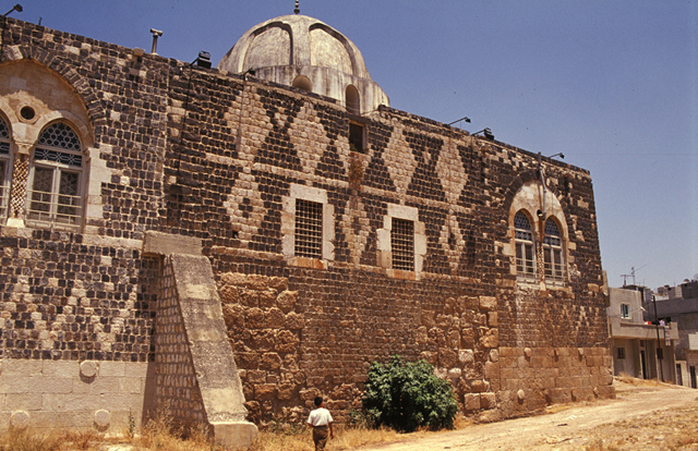Exterior view from southwest, showing qibla (south) wall and prayer hall dome
