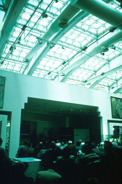 Interior view of gallery showing exposed piping and ceiling of glass