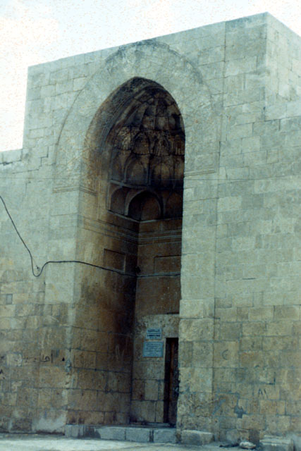 Exterior view showing stone muqarnas under pishtaq vault