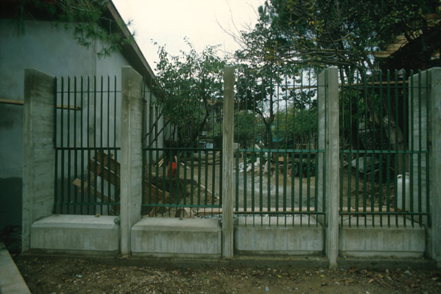 Exterior view through iron fence