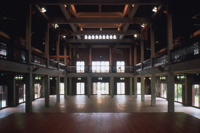 Interior view of main hall with elaborate wood work and iron fenced gallery