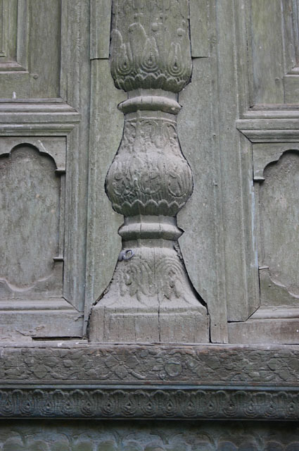 Detail of carved column base on summer mosque before restoration