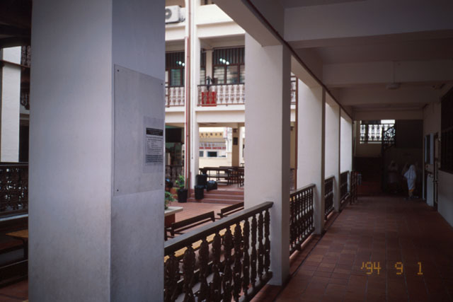 View along covered walkway on courtyard perimeter