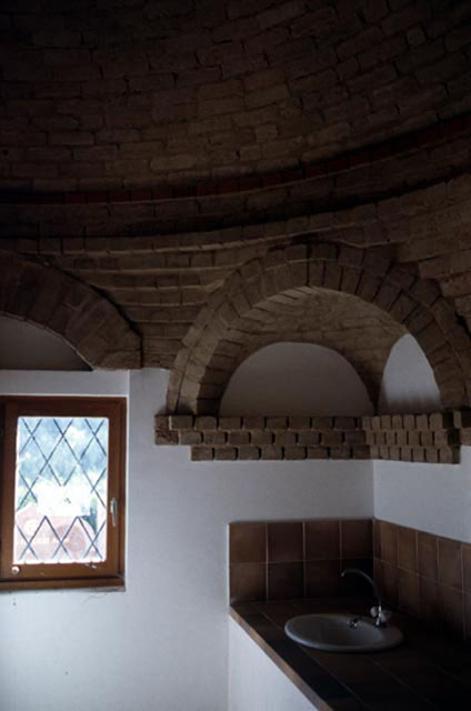Interior view of washroom, showing brickwork in the transition zone