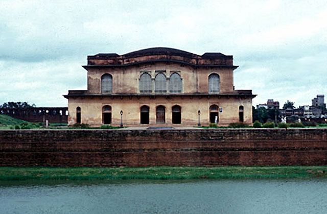 East façade. Masonry tank in foreground