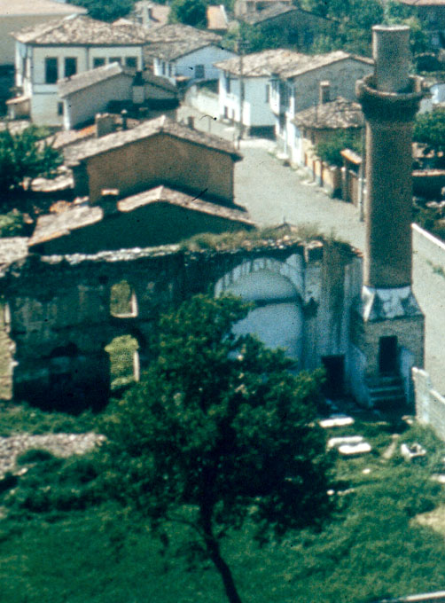 Elevated view from east showing the remains of the mosque, with the minaret seen to the right