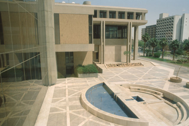 Exterior view showing fountain between glazed façade and street