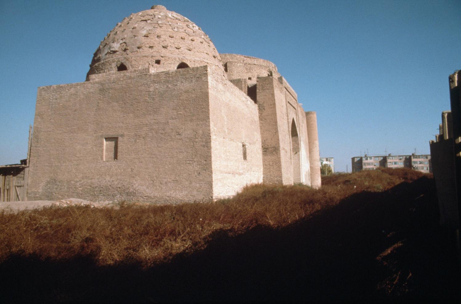 Exterior view from the southwest, with the intact dome of the western chamber, the mausoleum