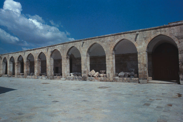 Exterior view showing arcade of vaults