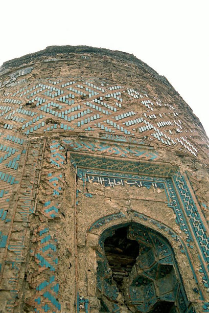 Exterior detail looking up at the muqarnas hood and inscription of the entrance