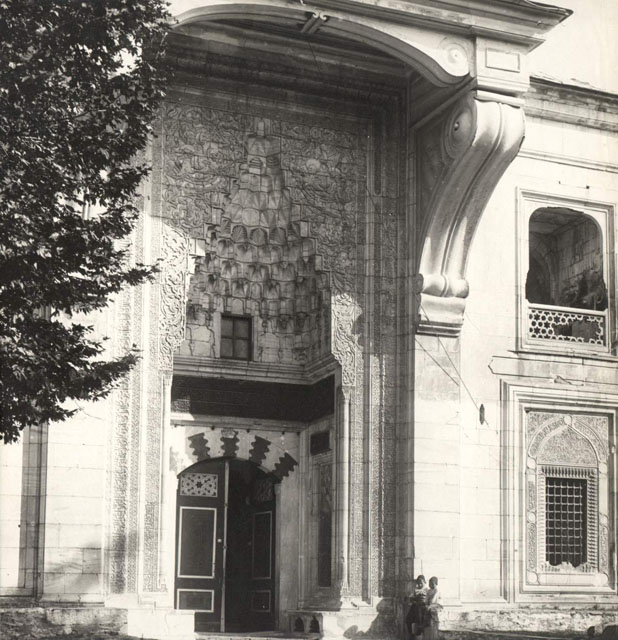 Exterior view of portal showing the nineteenth century addition of a fake-marble wooden canopy over entry, which was later removed