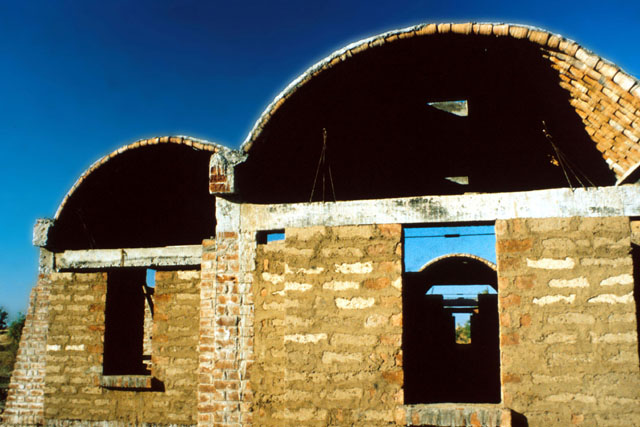 Exterior view, showing partially assembled roof and load bearing walls