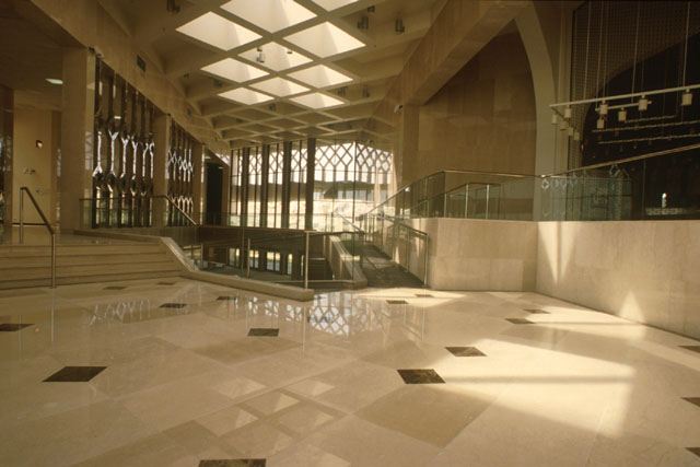 Interior view showing highly polished marble floors and floor to ceiling glazing at entrance