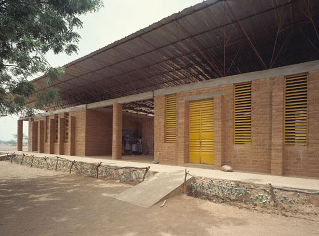 Partial exterior view from southeast, showing the western and central classrooms and patio in between