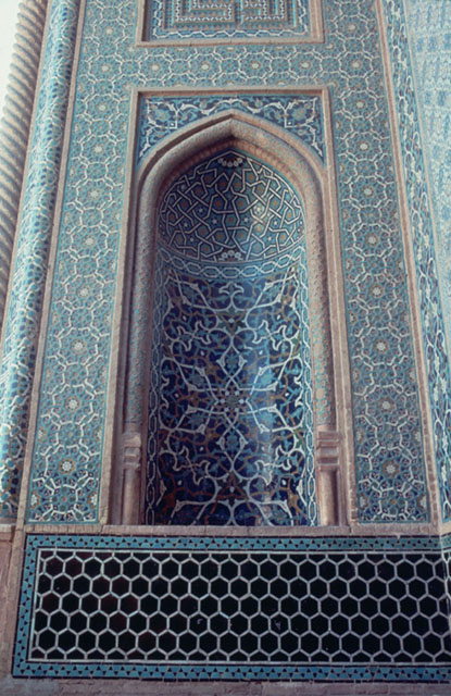 Detail of north portal; tiled niche on eastern flank