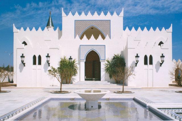 Mosque of the King - Exterior view across fountain to façade