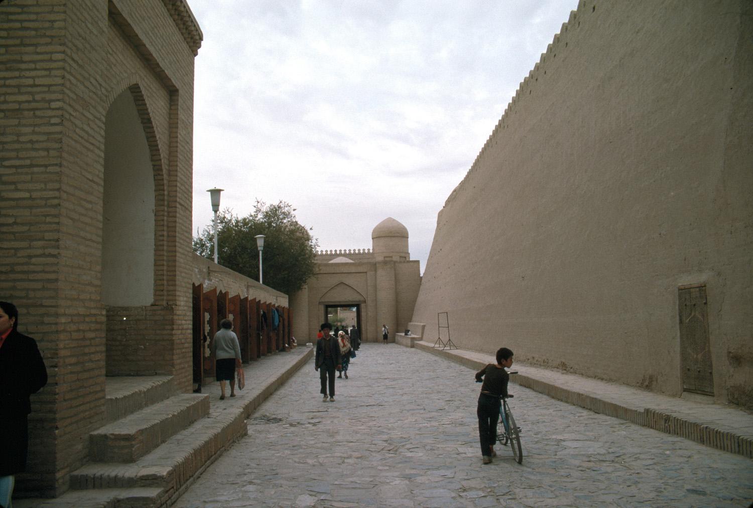 Exterior view of street between madrasa and Tash Hauli Palace