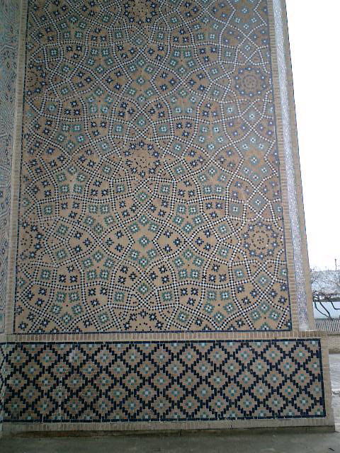 Inlaid mosaic panels and tilework dado on front portal